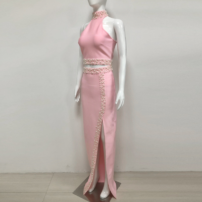 Unleash Your Inner Fashionista with this Pink Bandage Two-Piece Set featuring Pearl Details and High Slit Skirt