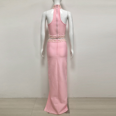 Unleash Your Inner Fashionista with this Pink Bandage Two-Piece Set featuring Pearl Details and High Slit Skirt
